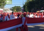Bupati Ismet dan Wabup Risman Awali Semarak Peringatan HUT ke-81 Kemerdekaan RI dengan Bentangkan Bendera Merah Putih Sepanjang 50 Meter