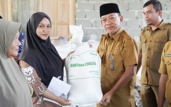 Salurkan Bantuan Pangan di Tabilaa, Pemkab Bolsel Minta Masyarakat Penuhi Kebutuhan Pokok Keluarga